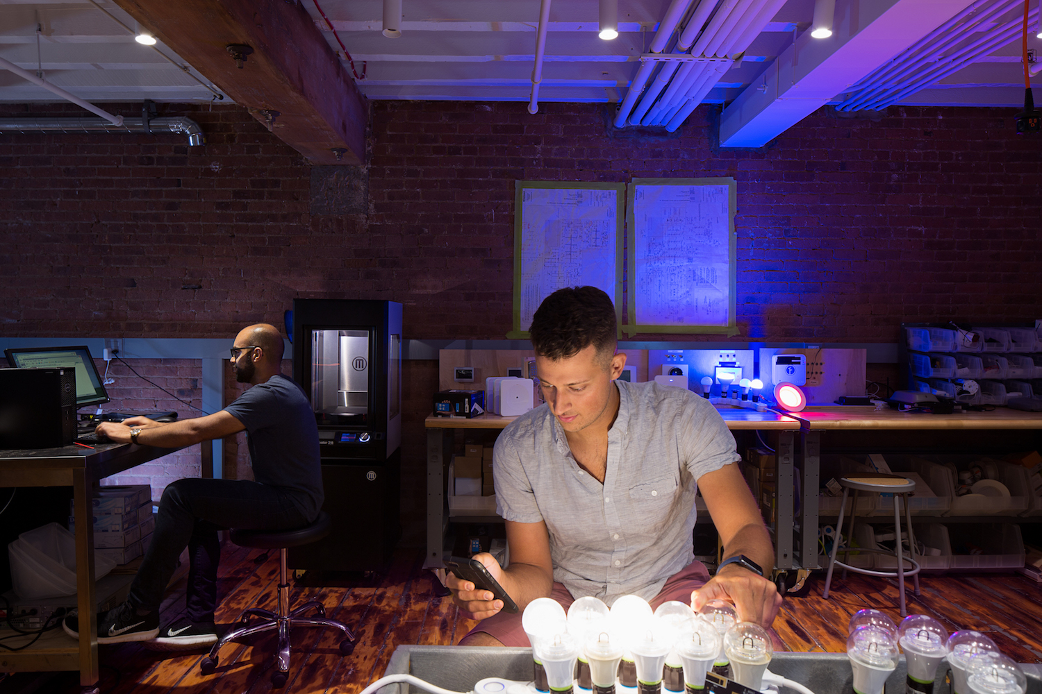 A photo of two Wink employees in the quality assurance lab